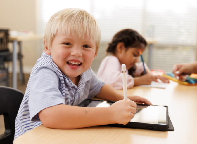 Student excited to start their lesson on a tablet