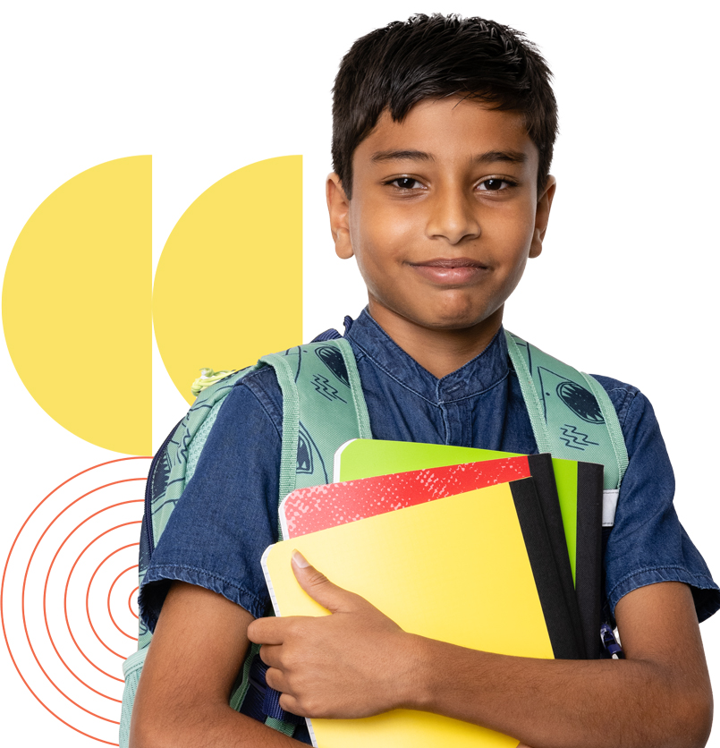 Student smiles for the camera with his bookbag and journals prepared to learn