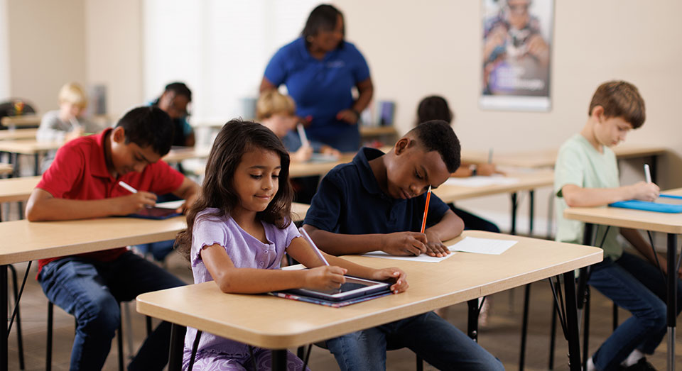 Students completing worksheets at a Kumon Center