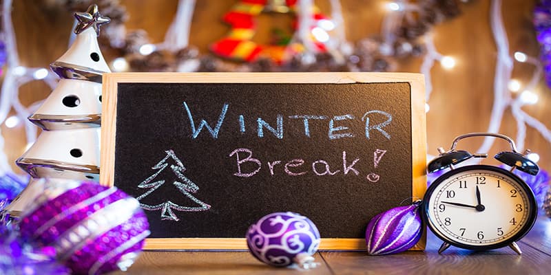 Winter Break written on chalkboard in room set for holiday learning