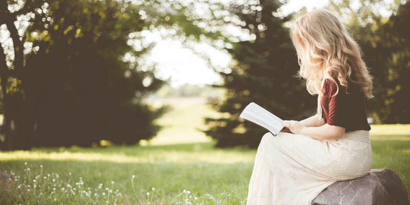 Girl reading poetry for the cover of Why does reading poems build our imagination and creativity