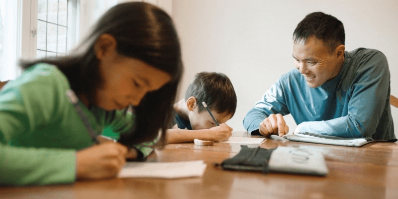 Glenn with family doing Kumon