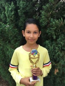 Sri Varshini holding trophy