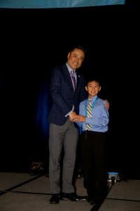 Alan shakes hands with KNA president Mino Tanabe