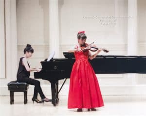 Rin, a gifted violinist, performs at Carnegie Hall
