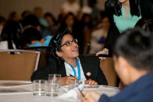 Sriya answers a questoin at the Student conference