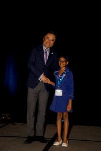 Agrini shakes hands with KNA President Mino Tanabe