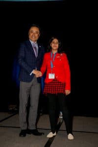 Laiba shakes hands with Kumon North America President Mino Tanabe