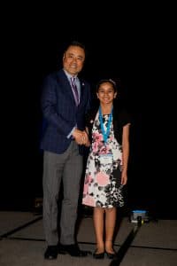 Arushi shakes hands with Kumon North America President Mino Tanabe