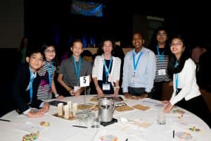Somya smiles with friends at the Kumon Student Conference