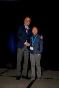 Noki shakes hands with Kumon North America President Mino Tanabe