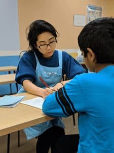 Jennifer helping a student