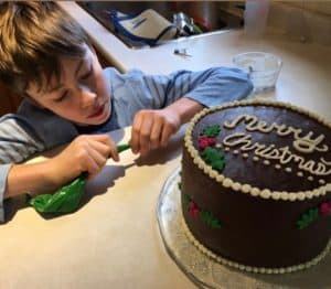 Davis decorates a cake.
