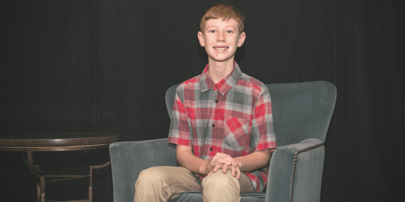 Justin sitting in a chair