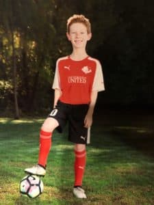 Justin in his soccer uniform