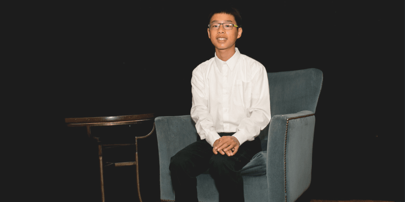Nathan sitting in a chair