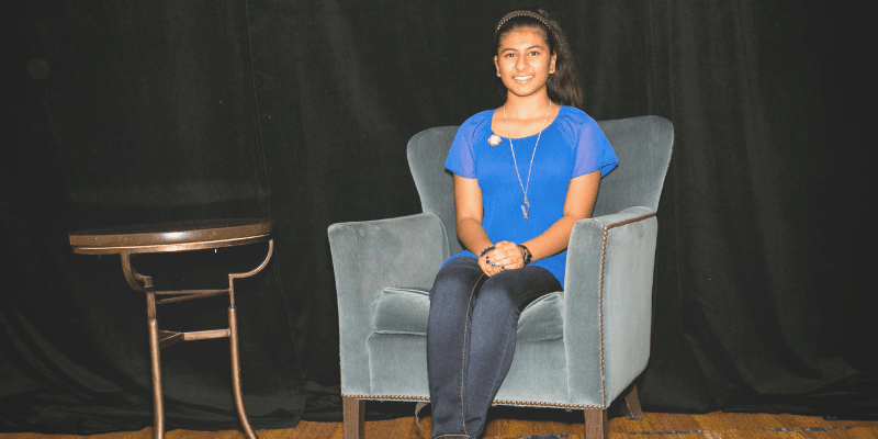 Nikita sitting in a chair