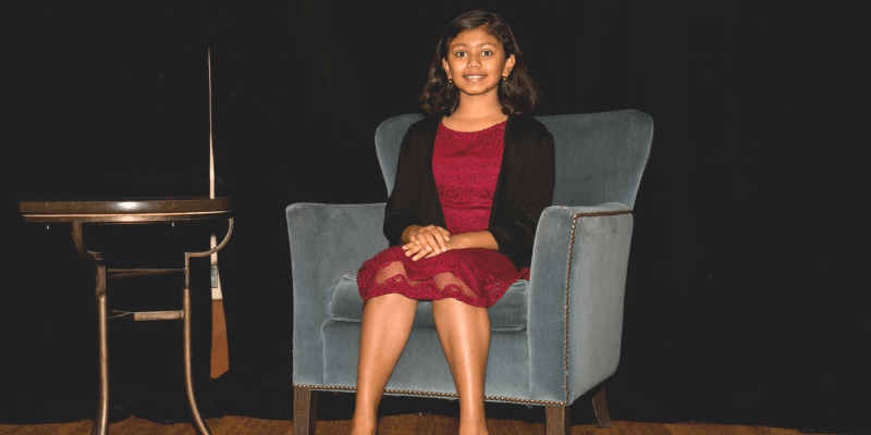 Suhani sits in a chair