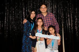 Zoha poses with her family at the Kumon Student Conference