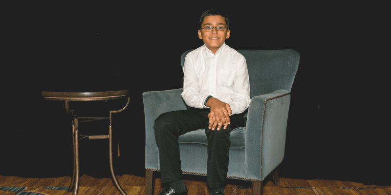 Abhinav sits in a chair