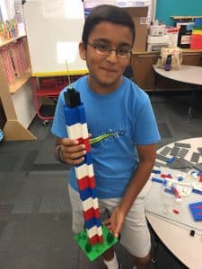 Abhinav stands in a blue shirt