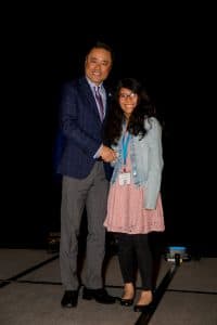 Uma shakes hands with Kumon North America President Mino Tanabe