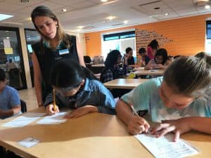 Laisa observes a student at her Kumon Center