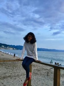 Uma poses on the beach in Mexico