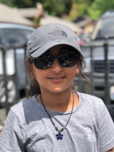 Sohavi poses in a gray baseball cap and gray tshirt