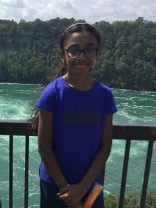 Varnica poses in front of a lake at Banff