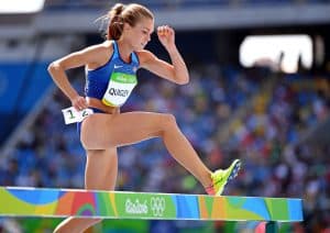 Colleen hurdles over a barrier during a steeplechase race 