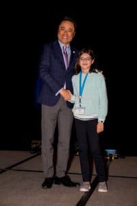 Cara shakes hands with Kumon North America President Mino Tanabe