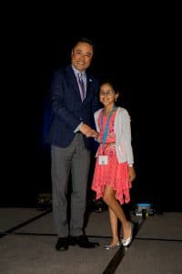Asmita shakes hands with Kumon North America president Mino Tanabe
