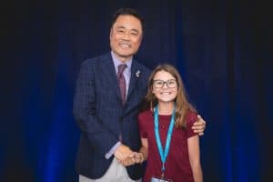 Zosia shakes hands with Kumon North America President Mino Tanabe
