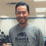 Rudi stands in front of his classroom