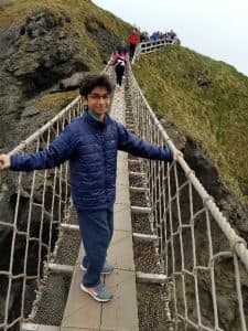 Shaylen poses on a bridge