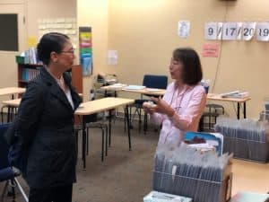 Aoi speaks to Mrs. Makii in her center