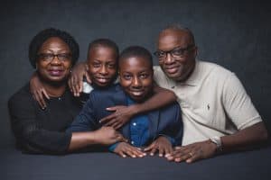 Temi poses with his family at the student conference