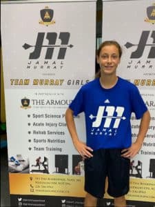Ava poses in her Team Murray Girls tshirt