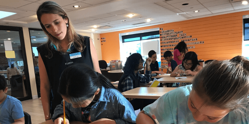 Laisa observes students at her center