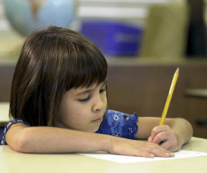 A student erases a mistake on a piece of paper
