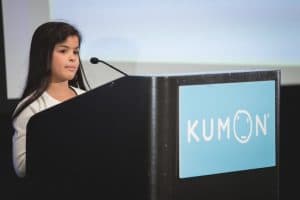 Jessica speaks at the poidum at the student conference