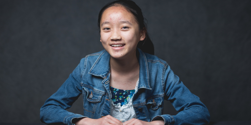 Headshot of young girl with jean jacket and nice smile