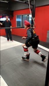 Hargoun practices hockey in a training facility
