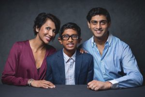 family portrait with a student named Kushal in the middle