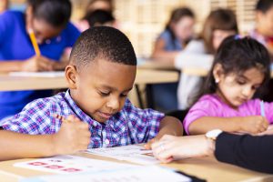 A boy does his Kumon reading worksheets at the center