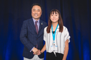 Kumon Student with KNA President shaking hands looking forward