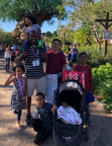 Family in front of nature scene