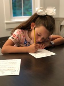 a student doing her worksheets