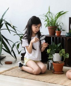 girl surrounded by plants